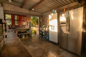 a kitchen with a large stainless steel refrigerator at Casa Playa Puerto luz in Santa Marta