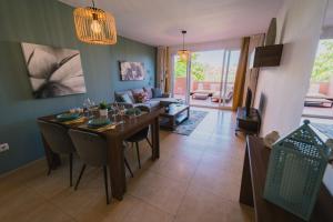 a living room with a dining table and a couch at Bonsai in Murcia