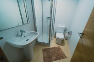 a bathroom with a sink and a shower and a toilet at Bonsai in Murcia +6 photos