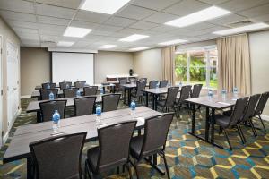 a conference room with tables and chairs and a whiteboard at Residence Inn by Marriott Fort Lauderdale City of Plantation in Plantation +43 photos