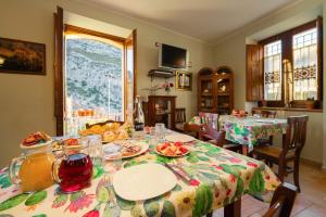 a dining room with a table with food on it at Il Belvedere in Civita