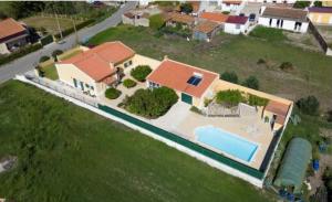 an overhead view of a house with a swimming pool at Villa Vona - private pool, beautiful garden in 3 BDR villa in Óbidos