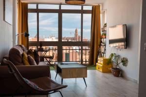 Televízia a/alebo spoločenská miestnosť v ubytovaní Atico deluxe en el centro by Lets Malaga