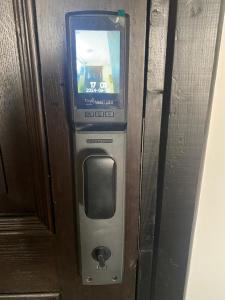 Un sistema de videojuegos con un televisor en la pared. en Females only Private bedroom stay with me Rehab city, en El Cairo