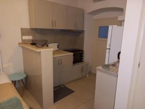 Kuchyň nebo kuchyňský kout v ubytování Studio CASINELLA