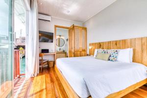 Postelja oz. postelje v sobi nastanitve Tropical Suites Hotel