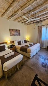 Cama ou camas em um quarto em Posada Borravino
