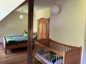 Postel nebo postele na pokoji v ubytování Grünlasmühle