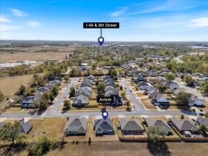 an aerial view of a town with houses and a street sign at Beautiful 3 bed 2 bath home near Crystal Bridges in Bentonville