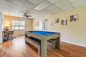 a room with a pool table in the middle of it at Lakefront Home with Private Boat Dock on Lake Lanier in Murrayville