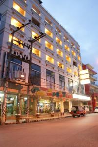 a large building with lights on the side of it at Hatyai Merridian Hotel in Hat Yai