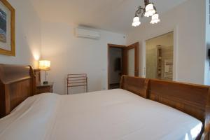 Postel nebo postele na pokoji v ubytování B&B Better Verona