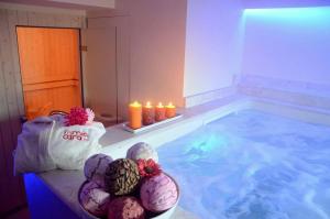 Postel nebo postele na pokoji v ubytování Hotel Mia Cara & Spa