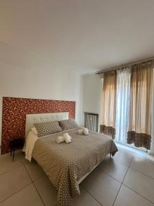 Postel nebo postele na pokoji v ubytování Il Tenore B&B
