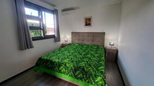 Postel nebo postele na pokoji v ubytování TAHITI - Domaine Mango Lodge