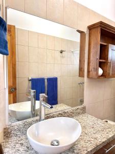 a bathroom with a sink and a mirror at Coco Maya 2b2b Villa in Coco
