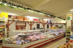 a grocery store filled with lots of food at Hotel Lotos in Woskrzenice Duże