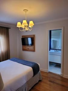 Μια τηλεόραση ή/και κέντρο ψυχαγωγίας στο Apartamento Lá-Bas