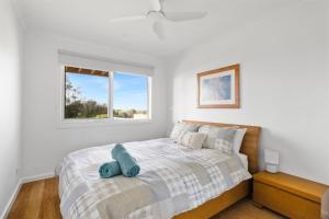 Glen Isla Seaside客房内的一张或多张床位