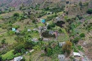 an aerial view of a village on a mountain at Alfa-apartamento in Pombas