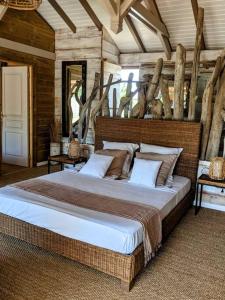 Giường trong phòng chung tại Villa Bois Chic