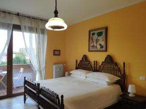 En eller flere senge i et værelse på Appartamento Aurora