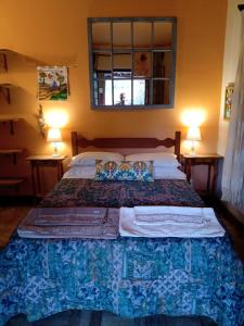 Ένα ή περισσότερα κρεβάτια σε δωμάτιο στο Pousada Santa Martha - Chalé - Entre Rios de Minas