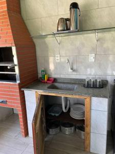 Η κουζίνα ή μικρή κουζίνα στο Casa ampla e aconchegante!