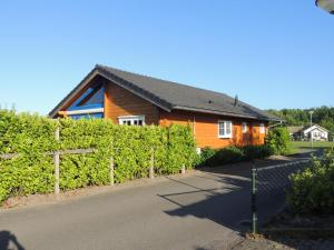 a house with a fence in front of it at ZeeWolf in Sint Annaland