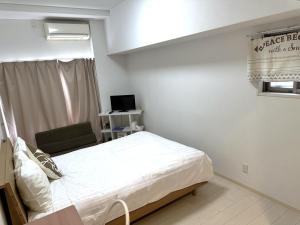 Voodi või voodid majutusasutuse Residence天王寺東 toas