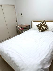 Voodi või voodid majutusasutuse Residence天王寺東 toas