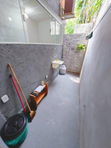 a concrete hallway with a toilet in a room at Infinity House hospedagem in Angra dos Reis +12 photos