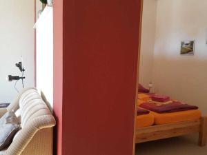 a mirror in a room with a bed at Holiday apartment in Waren Müritz in Waren