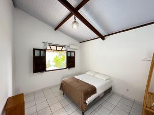 Postel nebo postele na pokoji v ubytování Casa Tropical Arraial D' Ajuda