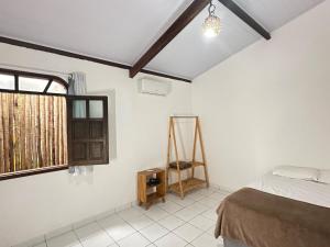 Postel nebo postele na pokoji v ubytování Casa Tropical Arraial D' Ajuda + 23 fotografií