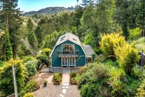 an overhead view of a blue house in the woods at Magic Mountain Manor - Spacious Mountain Retreat in Cazadero