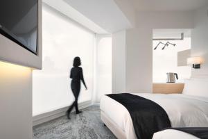 Letto o letti in una camera di Swiio Hotel Daan