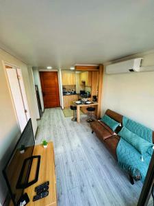 a living room with a couch and a table at Departamentos Real in Santiago