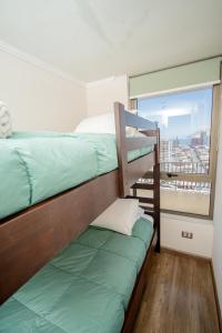 Departamento vista al marにあるベッド
