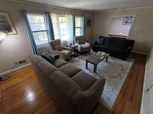 an overhead view of a living room with a couch and chairs at 5 mins to Fort Jackson - The Wooded Hilltop Ranch in Columbia
