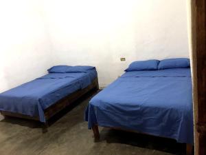 Postel nebo postele na pokoji v ubytování Cabaña Los Compadres