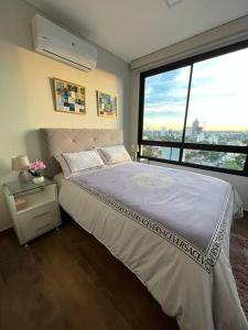 Ένα ή περισσότερα κρεβάτια σε δωμάτιο στο Depto exclusivo en Carmelitas