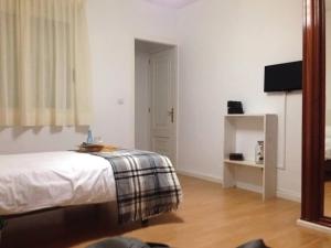 TV a/nebo společenská místnost v ubytování MON ComeySueña Guesthouse
