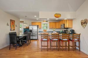 a kitchen with a table and chairs and a refrigerator at Lovely Mountain Home with Wifi and AC in Serene area of Morganton in Morganton