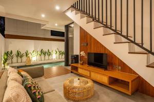 TV a/nebo společenská místnost v ubytování KAJA House Ubud