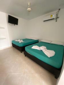 Postel nebo postele na pokoji v ubytování HOTEL Nancy