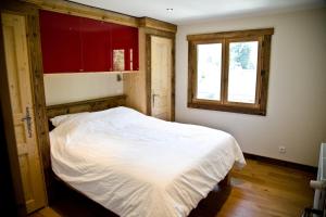 Säng eller sängar i ett rum på Chamonix Apartment