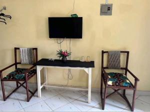 TV a/nebo společenská místnost v ubytování Armaan Guest House