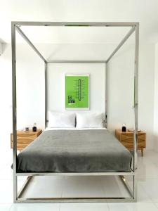 a bed with a metal canopy in a bedroom at White Lagoon in Hua Hin +22 photos