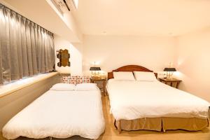 Posteľ alebo postele v izbe v ubytovaní Laurel B&B